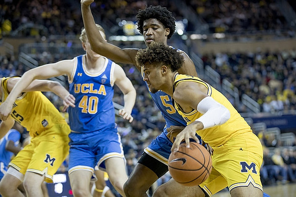 Jon Teske (15) and Isaiah Livers (4)