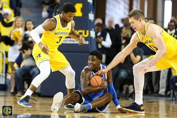 Zavier Simpson (3) and Moritz Wagner (13)