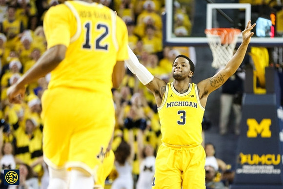 Muhammad-Ali Abdur-Rahkman (12) and Zavier Simpson (3)