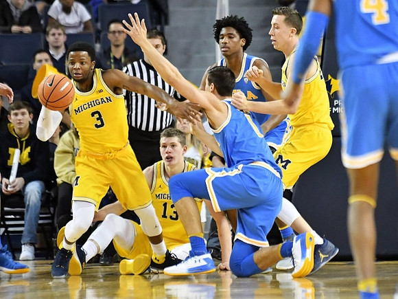 Zavier Simpson (3), Moritz Wagner (13), and Duncan Robinson (22)