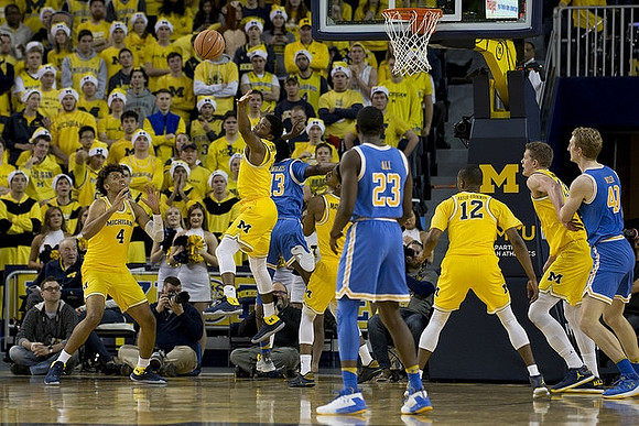 Isaiah Livers (4), Zavier Simpson (3), Muhammad-Ali Abdur-Rahkman (12), and Moritz Wagner (13)