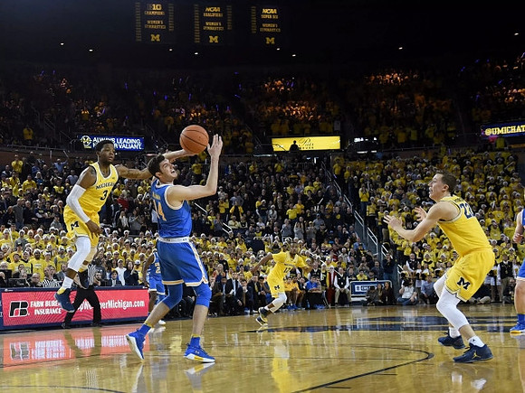 Zavier Simpson (3), Muhammad-Ali Abdur-Rahkman (12), and Duncan Robinson (22)