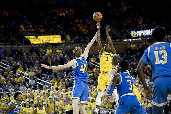 Charles Matthews (1) and Zavier Simpson (3)