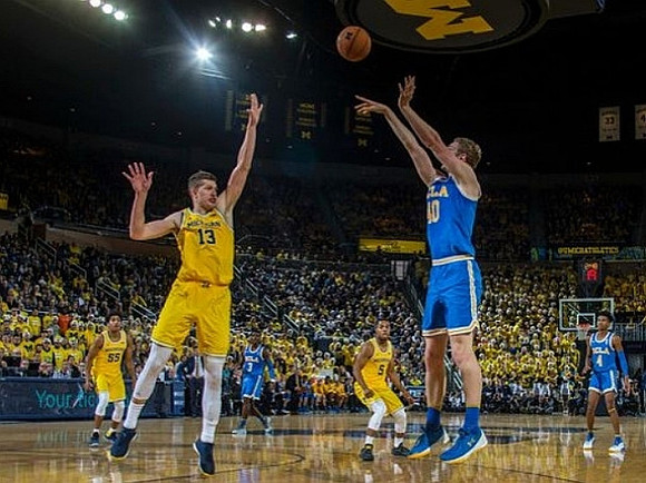 Eli Brooks (55), Moritz Wagner (13), and Jaaron Simmons (5)