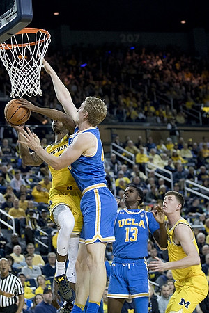 Charles Matthews (1) and Jon Teske (15)