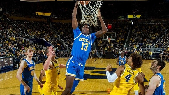 Moritz Wagner (13) and Isaiah Livers (4)