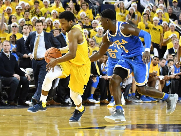 Zavier Simpson (3) and UCLA Head Coach Steve Alford