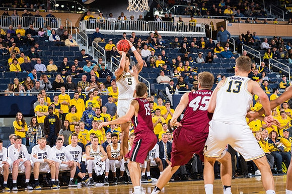 D.J. Wilson (5) and Moritz Wagner (13)