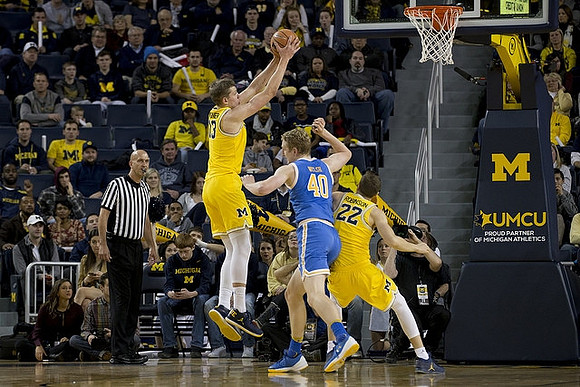 Moritz Wagner (13) and Duncan Robinson (22)