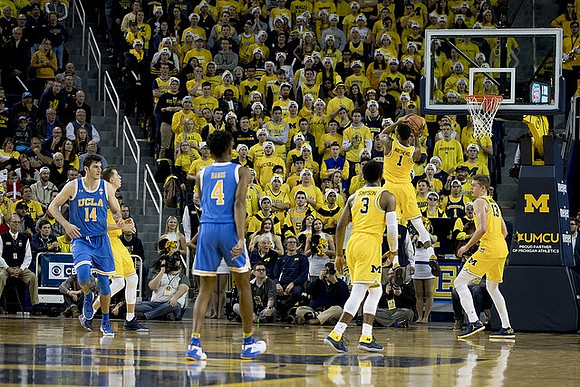 Duncan Robinson (22), Zavier Simpson (3), Charles Matthews (1), and Moritz Wagner (13)