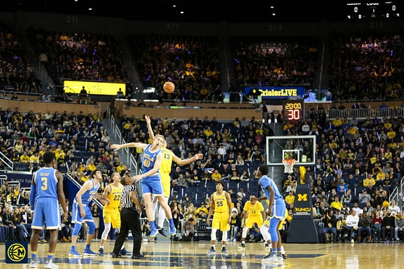 Duncan Robinson (22), Moritz Wagner (13), Eli Brooks (55), and Muhammad-Ali Abdur-Rahkman (12)