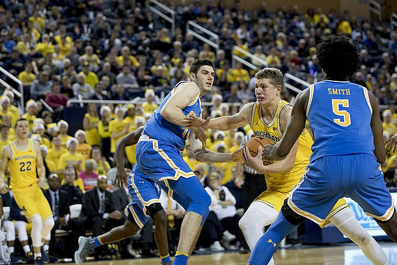 Duncan Robinson (22) and Moritz Wagner (13)