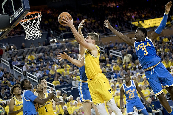 Moritz Wagner (13), Charles Matthews (1), and Isaiah Livers (4)