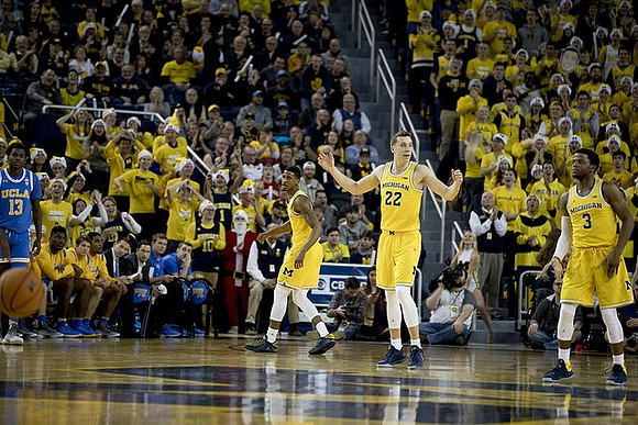 Charles Matthews (1), Duncan Robinson (22), and Zavier Simpson (3)
