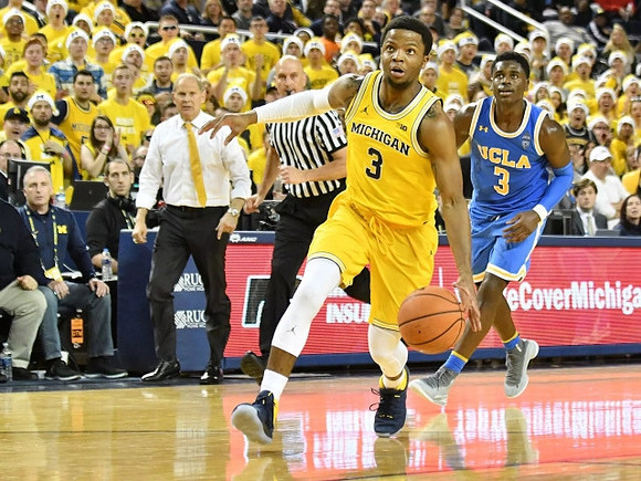 Zavier Simpson (3) and John Beilein