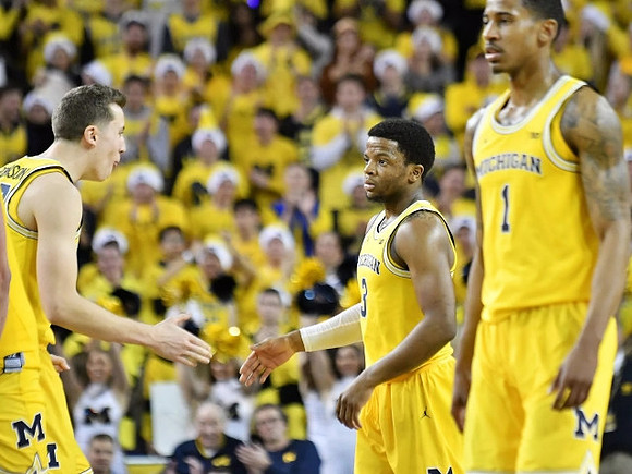 Duncan Robinson (22), Zavier Simpson (3), and Charles Matthews (1)