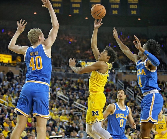 Eli Brooks (55) and Duncan Robinson (22)