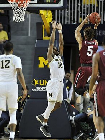 Muhammad-Ali Abdur-Rahkman (12) and Derrick Walton Jr. (10)