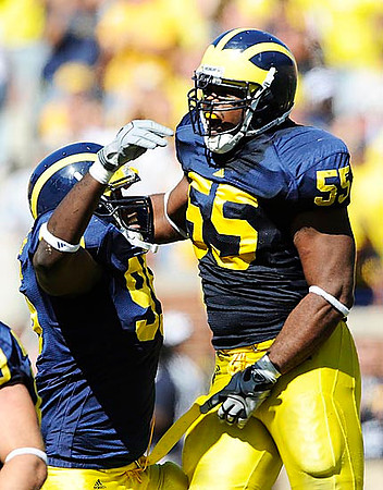 Adam Patterson (99) and Brandon Graham (55)
