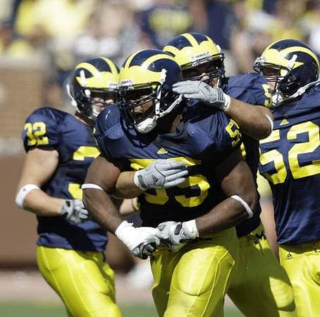 Jordan Kovacs (32), Brandon Graham (55), and Kevin Leach (52)