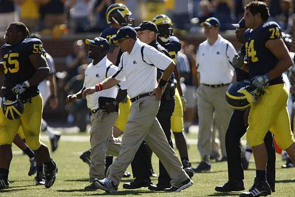 Brandon Graham (55), Rich Rodriguez, and John Ferrara (74)