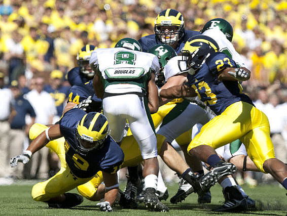 Zac Johnson (19), Mark Moundros (44), and Carlos Brown (23)