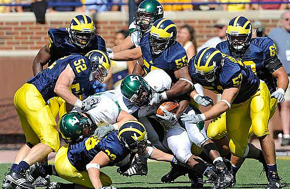 Obi Ezeh (45), Kevin Leach (52), Jordan Kovacs (32), Ryan Van Bergen (53), Brandon Graham (55), and Mike Martin (68)