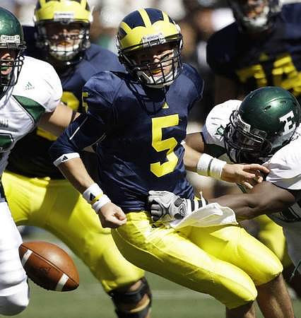 Tate Forcier (5) and John Ferrara (74)