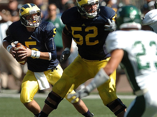 Tate Forcier (5) and Stephen Schilling (52)