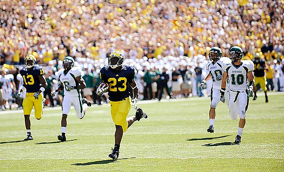 Greg Mathews (13) and Carlos Brown (23)