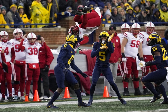 Mike Sainristil (0), DJ Turner (5), and Junior Colson (25)