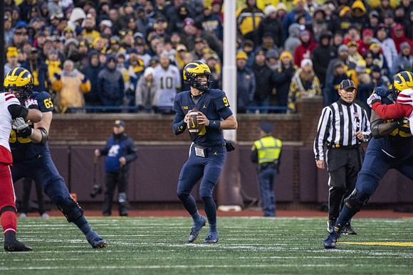Zak Zinter (65), J.J. McCarthy (9), and Olusegun Oluwatimi (55)