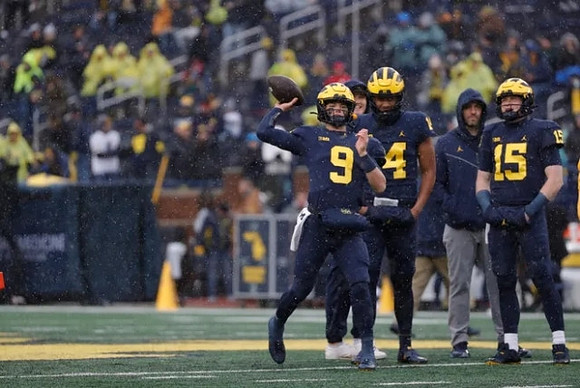 J.J. McCarthy (9), Jayden Denegal (14), and Alan Bowman (15)