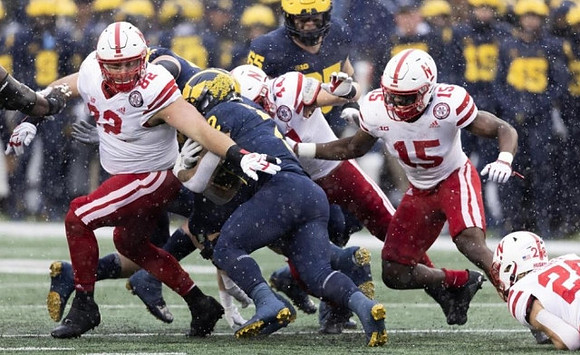Blake Corum (2) and Zak Zinter (65)