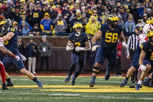 Colston Loveland (18), Blake Corum (2), Giovanni El-Hadi (58), Ronnie Bell (8), and Joel Honigford (84)