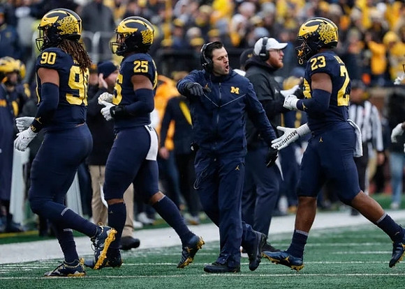 Mike Morris (90), Junior Colson (25), George Helow, Jay Harbaugh, and Michael Barrett (23)