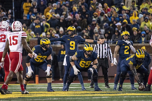 Karsen Barnhart (52), J.J. McCarthy (9), Zak Zinter (65), Blake Corum (2), and Olusegun Oluwatimi (55)