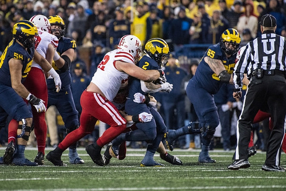 Giovanni El-Hadi (58), Ryan Hayes (76), Blake Corum (2), and Zak Zinter (65)