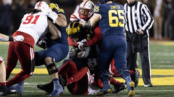 Giovanni El-Hadi (58), Blake Corum (2), and Zak Zinter (65)