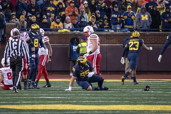 Derrick Moore (8), Mason Graham (55), and Michael Barrett (23)