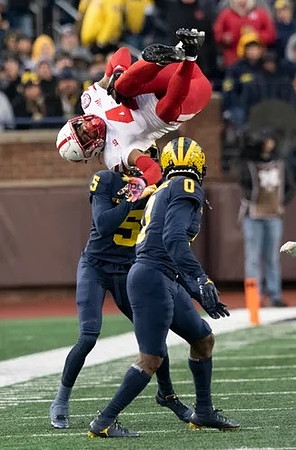DJ Turner (5) and Mike Sainristil (0)