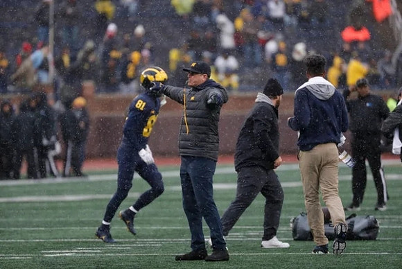 Louis Hansen (81) and Jim Harbaugh