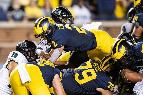 Blake Corum (2) and Jeffrey Persi (79)