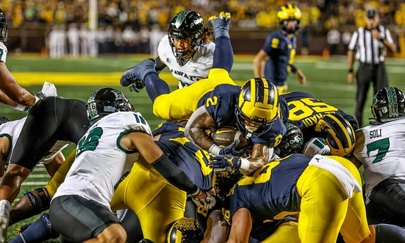 Blake Corum (2), Giovanni El-Hadi (58), and Luke Schoonmaker (86)