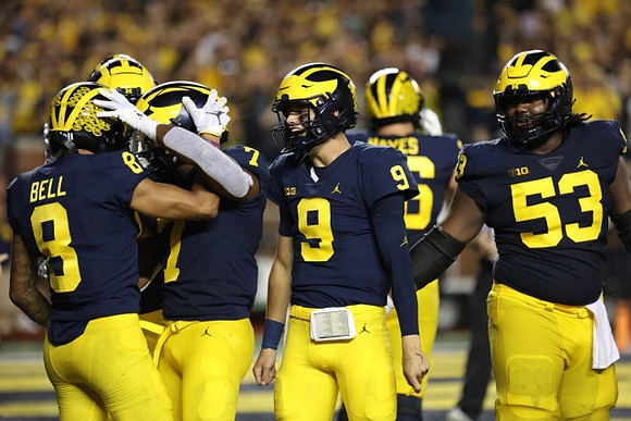 Ronnie Bell (8), Donovan Edwards (7), J.J. McCarthy (9), Ryan Hayes (76), and Trente Jones (53)