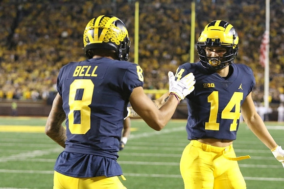 Ronnie Bell (8) and Roman Wilson (14)