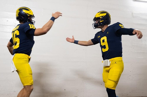Davis Warren (16) and J.J. McCarthy (9)