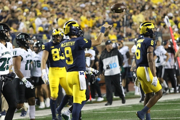 Erick All (83), J.J. McCarthy (9), and Cornelius Johnson (6)