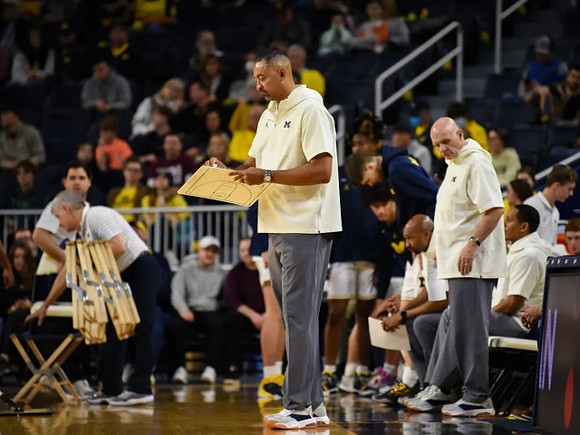 Juwan Howard and Phil Martelli
