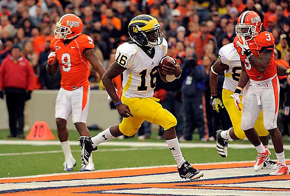 Denard Robinson (16) and Kevin Koger (86)